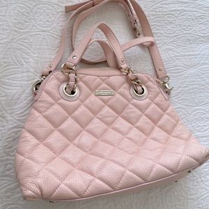 Pink quilted Kate spade purse.
